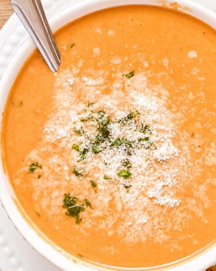 This bold and ultra flavorful Creamy Tomato Basil Soup is out of this world amazing! It uses a lot of pantry staple ingredients, and can easily be made in the slow cooker, Instant Pot, or right on your stovetop. You won't want canned tomato soup ever again! #tomatosoup #creamytomato #soup