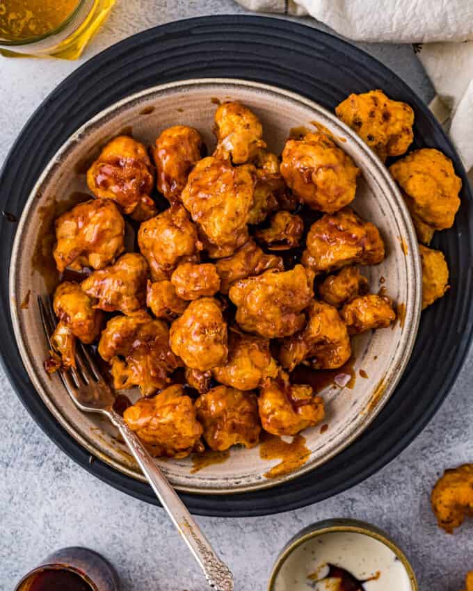 bowl of cauliflower bites coated in honey chipotle sauce