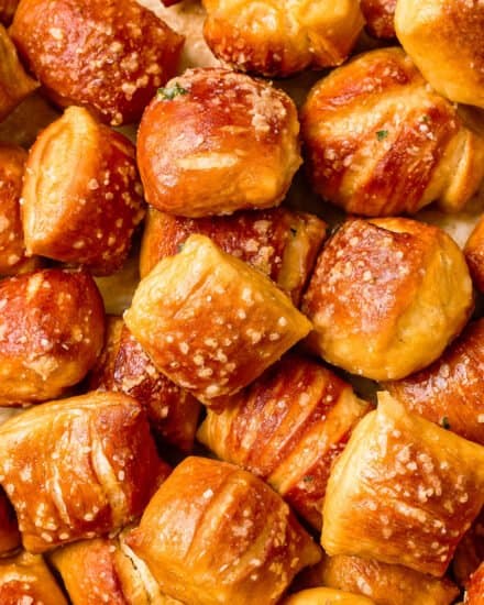 These Baked Soft Pretzel Bites are soft and chewy inside, with a crunchy, crackly exterior, and are absolutely fabulous dipped in beer cheese or mustard! Easier to make than you think, pretzel bites are so much better than anything store-bought! #softpretzels #pretzelbites #baked