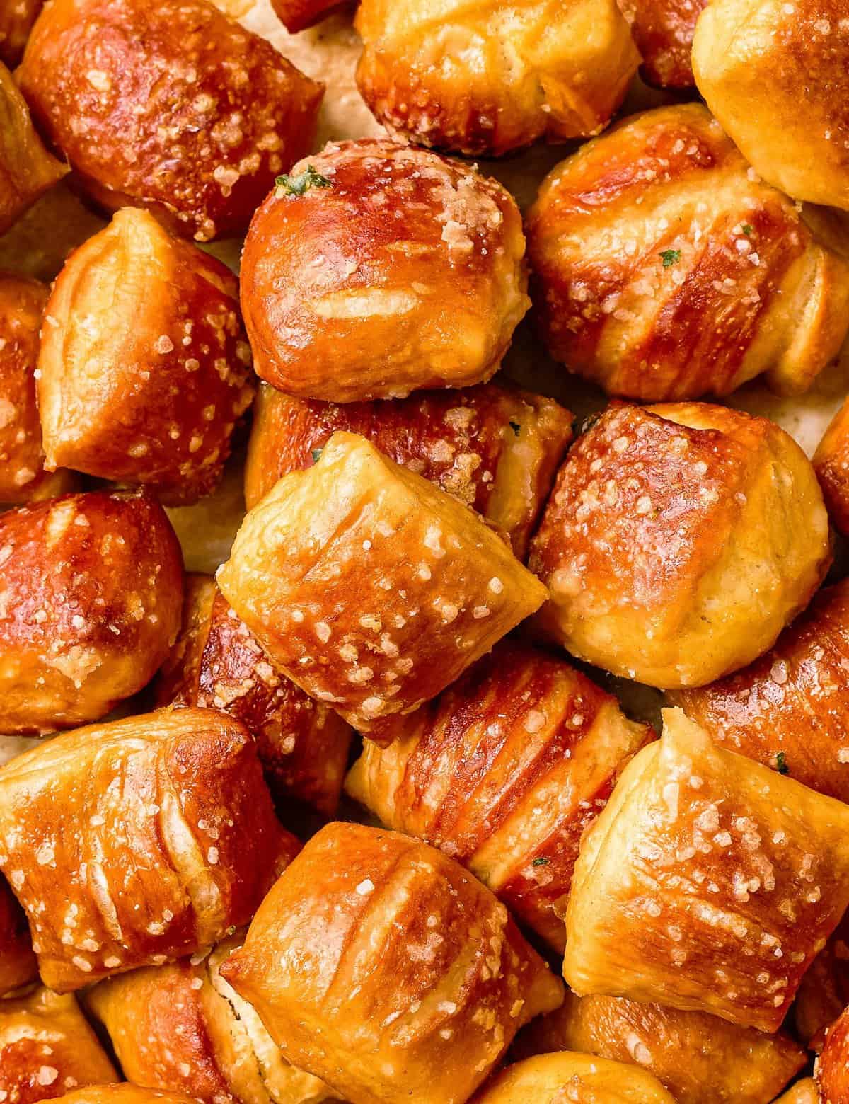 These Baked Soft Pretzel Bites are soft and chewy inside, with a crunchy, crackly exterior, and are absolutely fabulous dipped in beer cheese or mustard! Easier to make than you think, pretzel bites are so much better than anything store-bought! #softpretzels #pretzelbites #baked