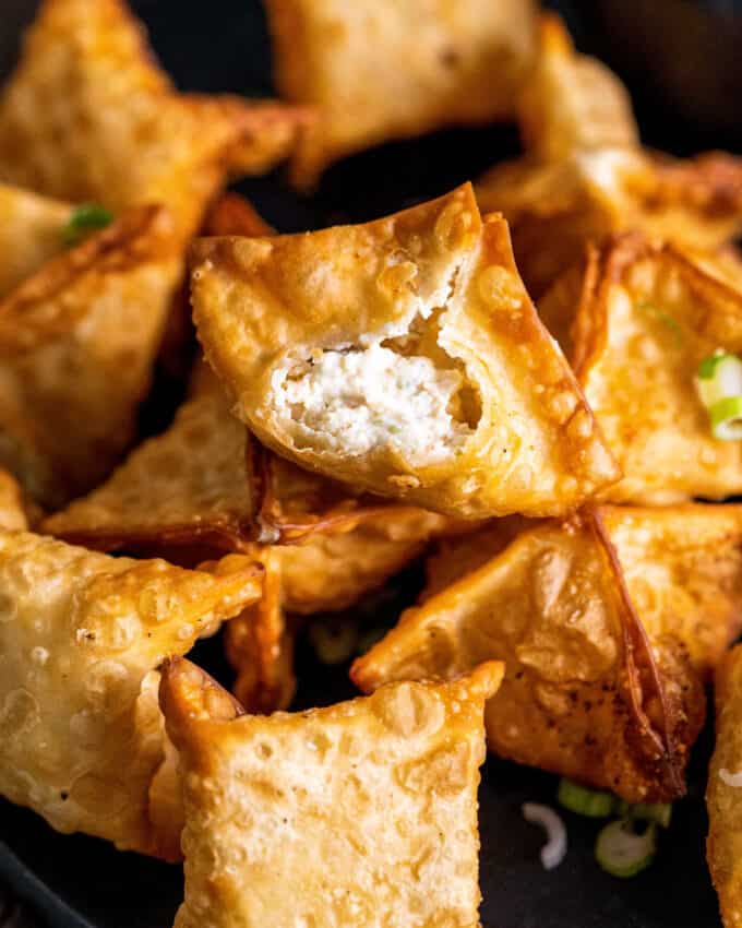 crab rangoon with a bite taken out of it