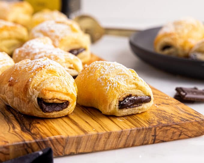 This shortcut version of the French classic, chocolate croissants, or pain au chocolat, is sinfully delicious right out of the oven! Store-bought puff pastry dough makes this recipe accessible to bakers of all confidence levels, and they're a perfect weekend breakfast treat! #chocolate #croissant #painauchocolat #baking