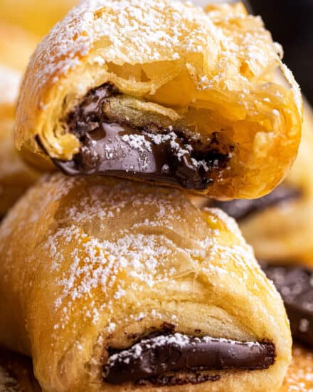 This shortcut version of the French classic, chocolate croissants, or pain au chocolat, is sinfully delicious right out of the oven! Store-bought puff pastry dough makes this recipe accessible to bakers of all confidence levels, and they're a perfect weekend breakfast treat! #chocolate #croissant #painauchocolat #baking