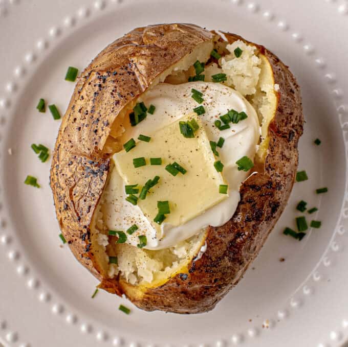baked potato with butter sour cream and chives