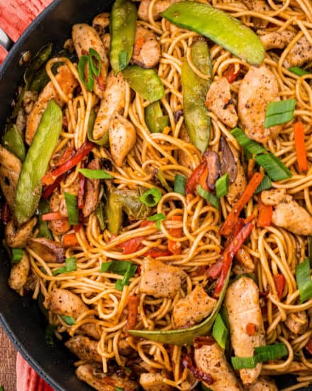 Better than takeout, this Chicken Lo Mein recipe comes together quickly, in one skillet, and is full of juicy chicken, tender lo mein noodles, and crisp tender veggies, all coated in a silky savory sauce!
