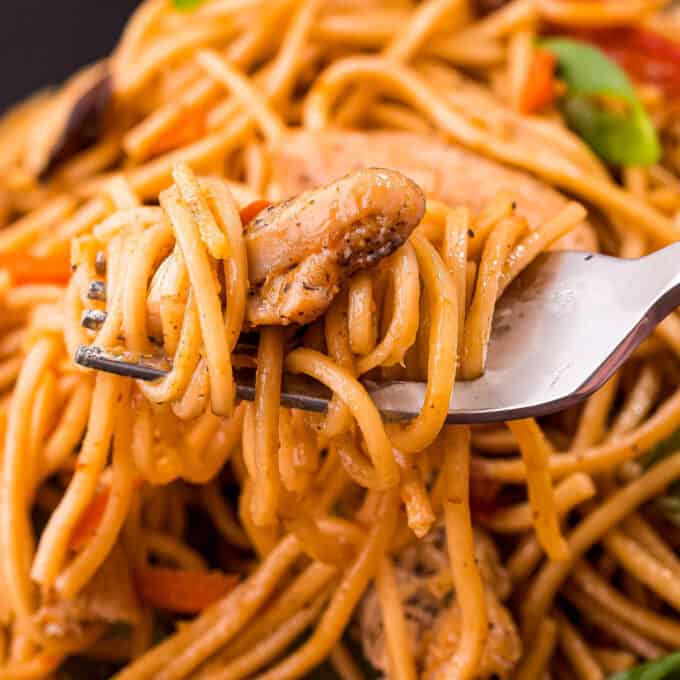 chicken lo mein twirled on fork