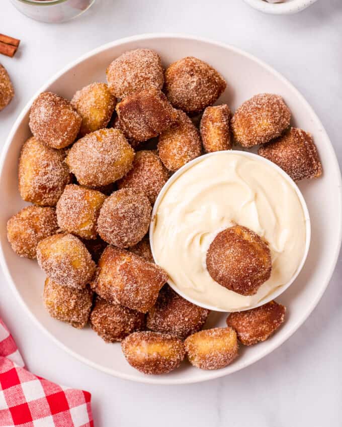 plate of cinnamon sugar pretzel bites with dip