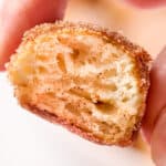 closeup of a soft pretzel bite bitten in half