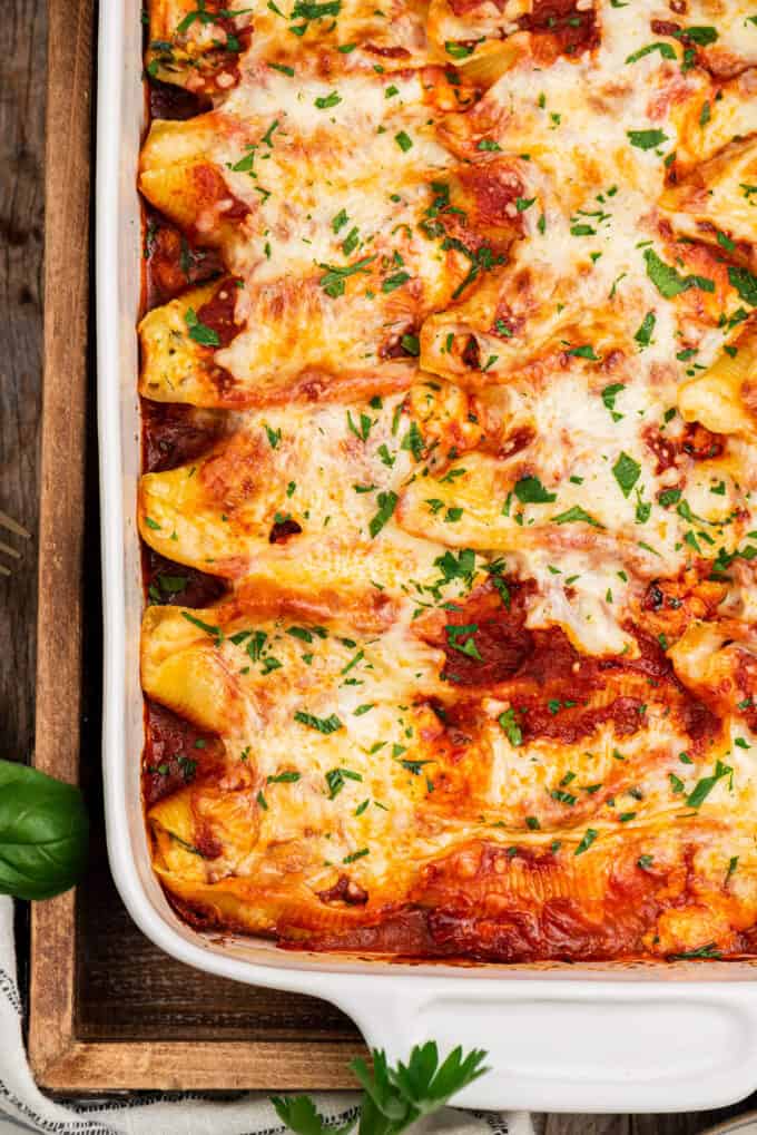 overhead photo of shells baked in sauce and cheese in baking dish