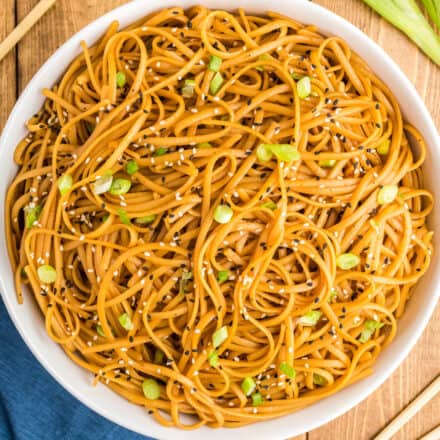 overhead view of white bowl full of sesame noodles