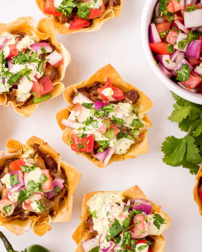 overhead view of taco cups with pico de gallo