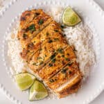 sliced grilled chicken with tequila lime marinade on a bed of rice
