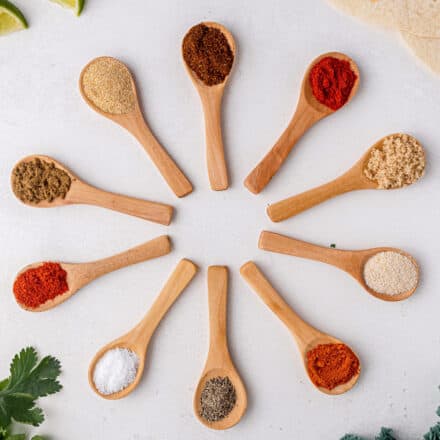 fajita seasoning spices on small spoons in circle