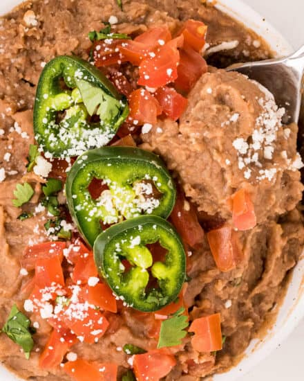 These Instant Pot Refried Beans are so full of flavor and easy to make, with no soaking required! Tastes way better than canned, and every bit as delicious as the beans from your local Mexican restaurant!