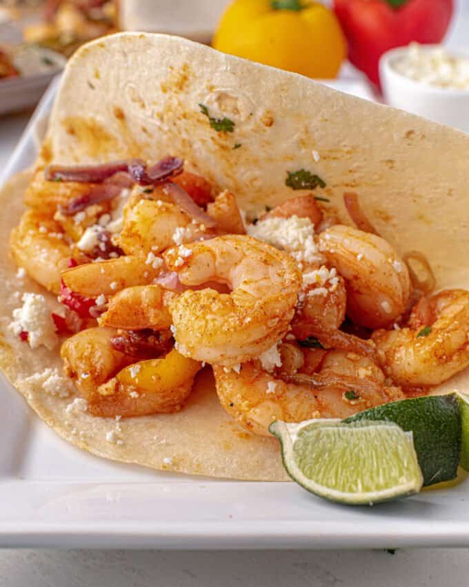 shrimp fajita tacos on white plate