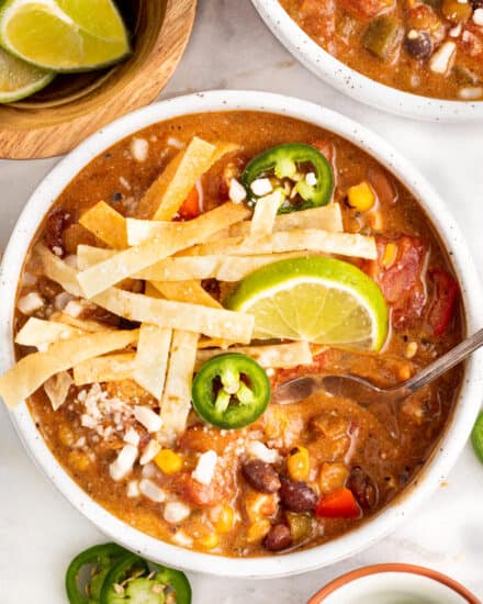 Delicious and creamy, this Vegetarian Tortilla Soup is packed with bold flavors, made easily with common and easy to find ingredients, economical, and can be made in the slow cooker, Instant Pot, or on the stovetop!