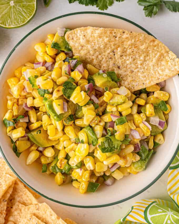 bowl of corn salsa with tortilla chip