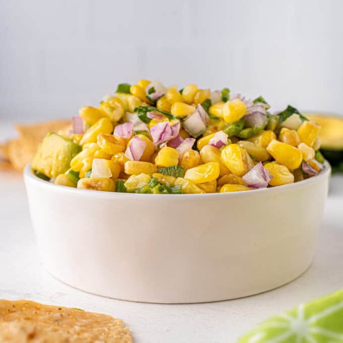 ramekin of corn salsa with avocado