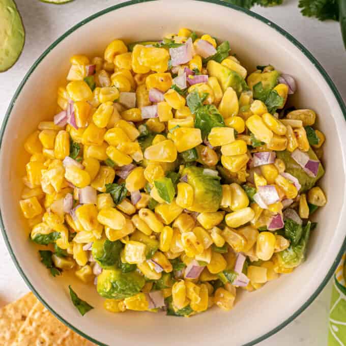 white bowl of corn salsa with avocado