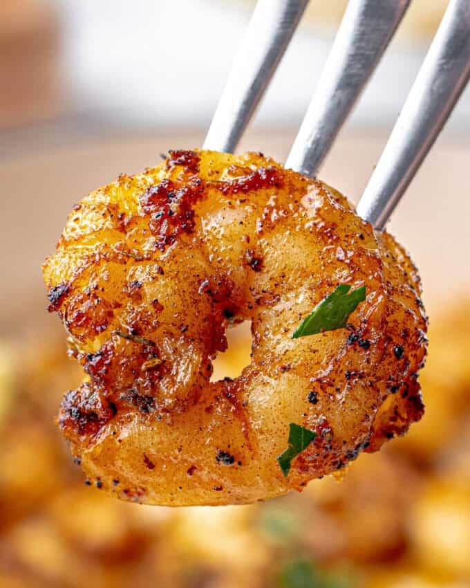 shrimp with blackening seasoning on a fork