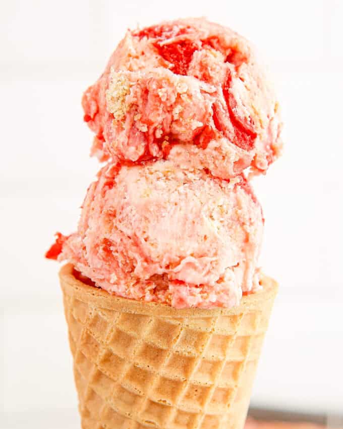 two scoops of cherry pie no churn ice cream in waffle cone