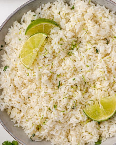 Soft and fluffy rice, flavored with bright citrus and herbs, made easily in the Instant Pot. Complete with stovetop directions as well, this cilantro lime rice is perfect with any Tex-Mex style recipe!