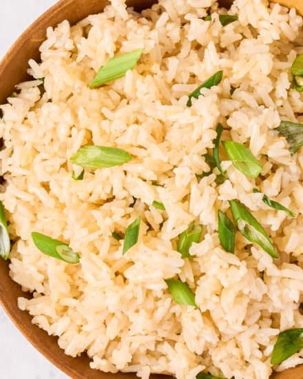 Soft and fluffy jasmine rice, flavored with garlic, ginger and toasted sesame oil, made easily in the Instant Pot, and perfect as an Asian-inspired side dish!