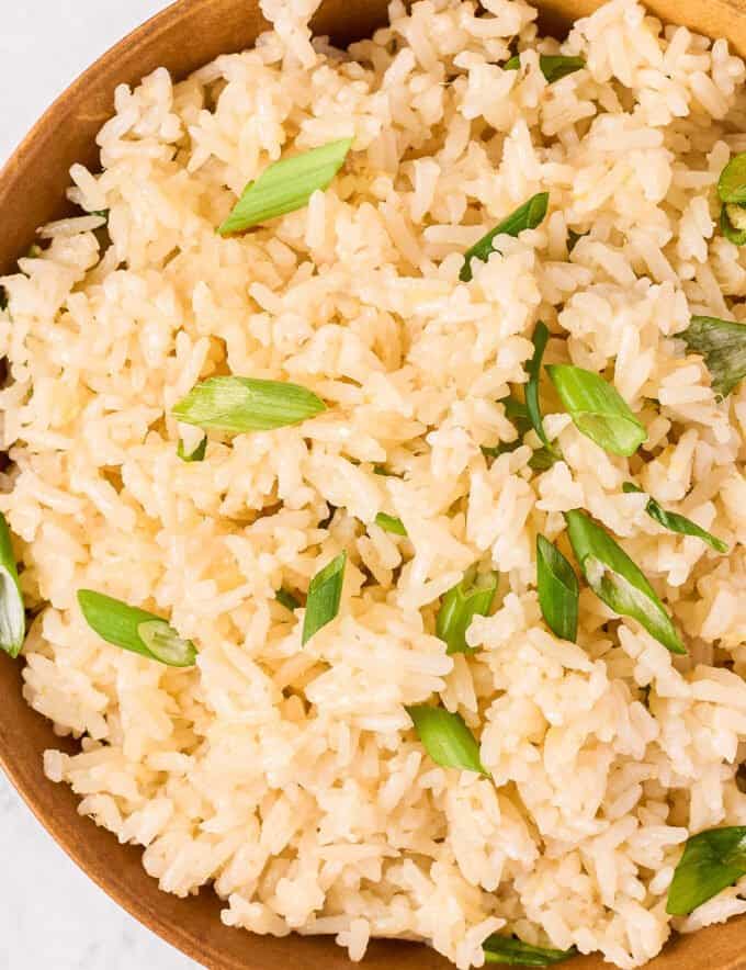 Soft and fluffy jasmine rice, flavored with garlic, ginger and toasted sesame oil, made easily in the Instant Pot, and perfect as an Asian-inspired side dish!