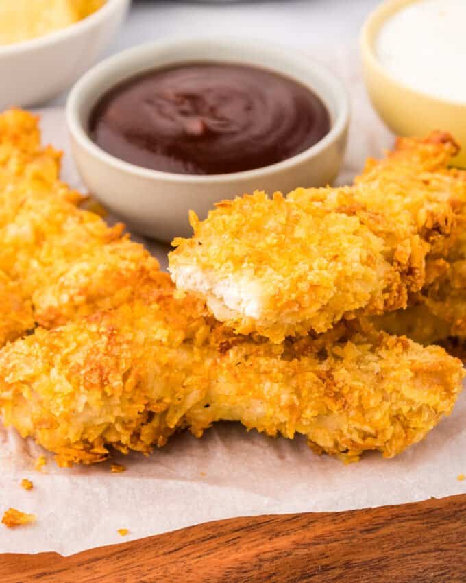 air fryer chicken tender with a bite taken out of it