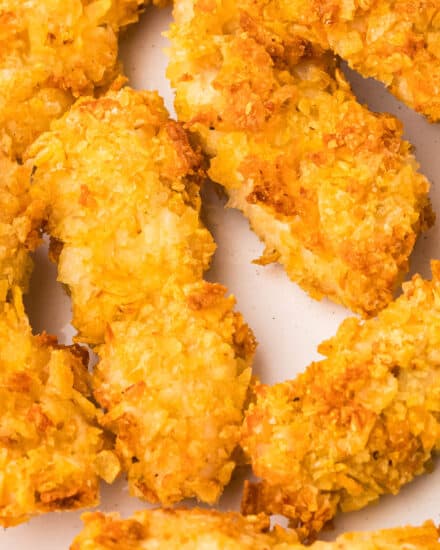 Fresh chicken tenders are dipped in a seasoned egg mixture, then coated in salty crushed potato chips. These crusted chicken tenders are absolutely amazing, and so easy to make in the air fryer or oven!