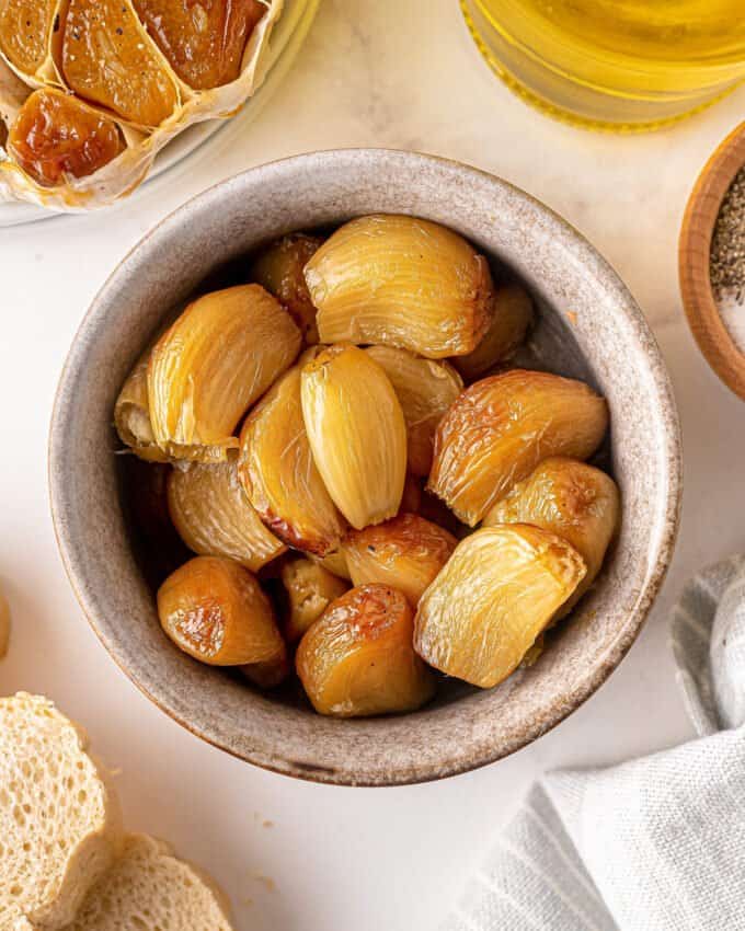 cloves of roasted garlic in small bowl