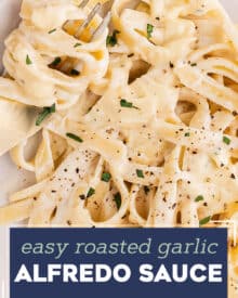 This Roasted Garlic Alfredo Sauce is rich, creamy, and absolutely loaded with flavor. Made with roasted garlic, heavy whipping cream, butter, Parmesan cheese and spices, this creamy sauce is amazing on pasta, as a dip for bread, and more!