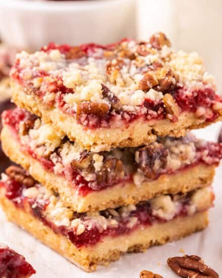 These amazing Cherry Pie Bars are made with a buttery shortbread crust, sweet/tart cherry pie filling, topped with shortbread crumbles and a sweet almond glaze! Such an easy dessert, and a great way to make pie for a crowd!