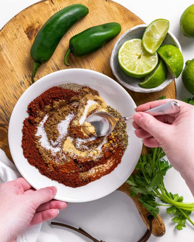 stirring the spices together for homemade taco seasoning