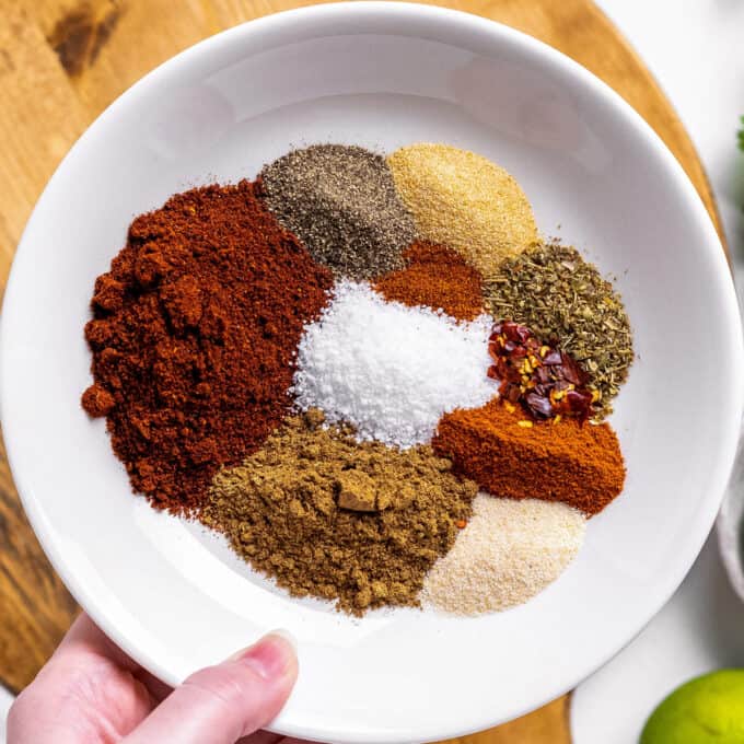 spices for taco seasoning in small white bowl