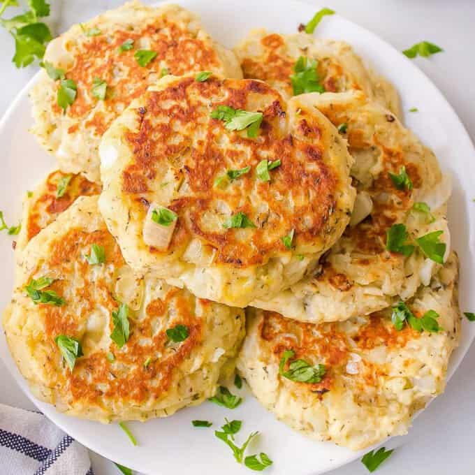 pile of potato pancakes on a white plate