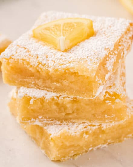 This is the ultimate in refreshing and light desserts… creamy lemon squares made all from scratch with a buttery shortbread crust, and tangy and bright lemon filling!  So foolproof… anyone can make these lemon bars!