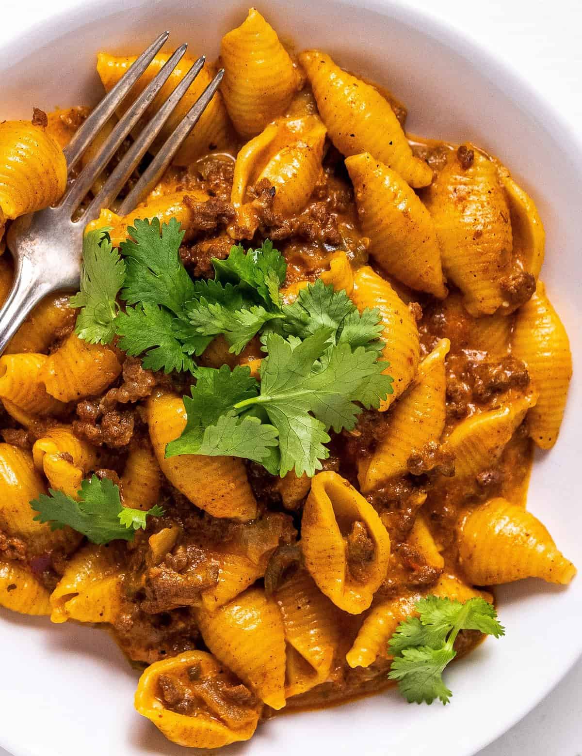 This taco pasta is a super simple one pot dinner that's hearty, cheesy, and made easily in the Instant Pot! The mild heat level makes this perfect for kids and families, but it's also easily customize-able!