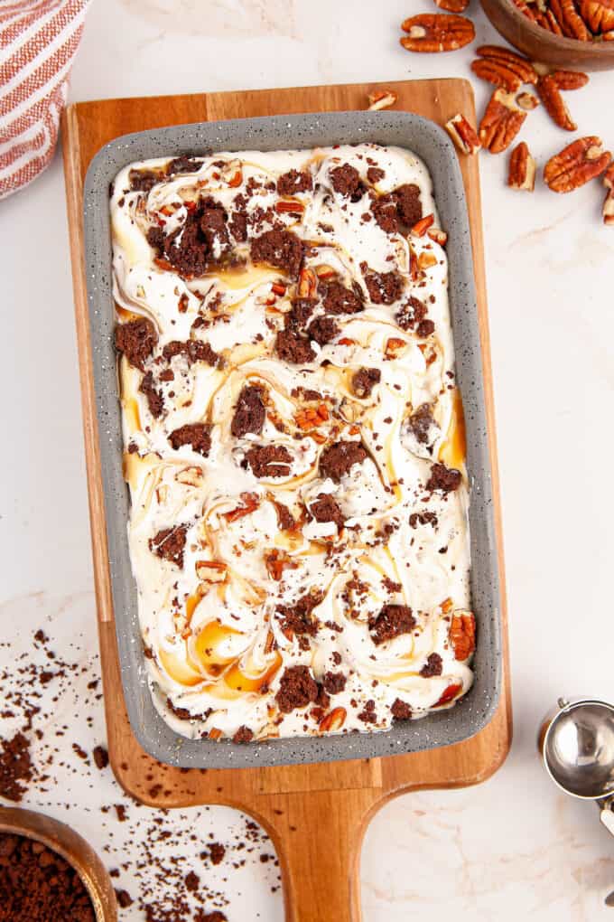 loaf pan full of no churn ice cream on a wooden platter