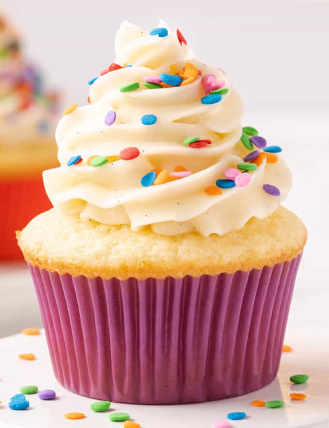 These vanilla cupcakes are the perfect blend of fluffy, soft, and moist! They are the perfect base recipe to add extra flavors to, great with any frosting, and amazing for birthdays and all celebrations!