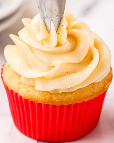 Decadently silky, creamy, and sweet, this vanilla buttercream frosting is made in just a few minutes with a handful of simple ingredients. Speckled with rich vanilla beans, this frosting is versatile, and perfect for cupcakes, cakes, and more!