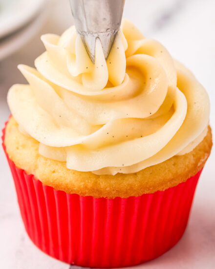 Decadently silky, creamy, and sweet, this vanilla buttercream frosting is made in just a few minutes with a handful of simple ingredients. Speckled with rich vanilla beans, this frosting is versatile, and perfect for cupcakes, cakes, and more!