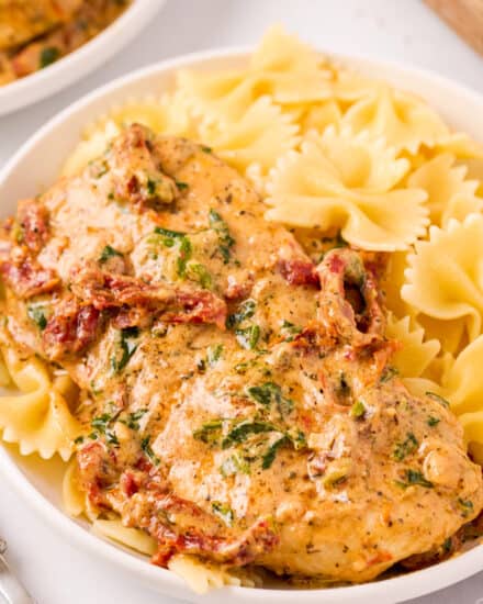 This One Pan Tuscan Chicken is a quick and easy one-pot meal that's sure to be a family favorite!  Juicy chicken, a creamy sauce made with bursts of sun dried tomatoes, Parmesan cheese and spinach, and it's all ready in about 30 minutes, making it a great weeknight dinner option.