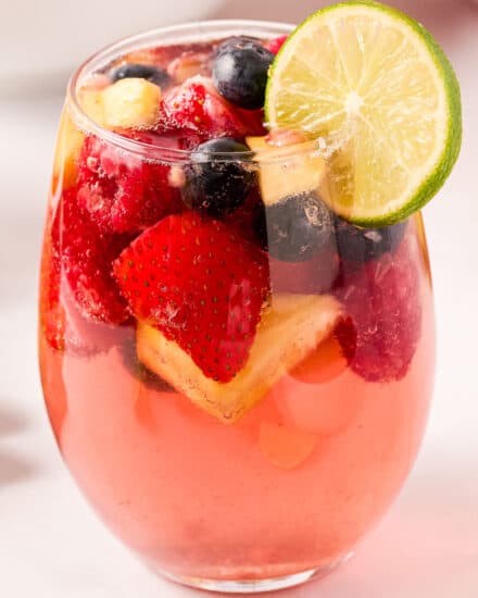 This light and sweet twist on a classic sangria recipe uses sweet moscato wines, raspberry liqueur, plenty of fruit, and made bubbly with lemon lime soda and seltzer water! Great to make ahead and loved by all!