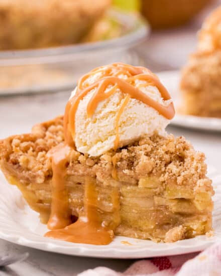 This Classic Dutch Apple Pie recipe has a flaky crust, sweet and tender spiced apples, and a buttery streusel topping! Perfect for holidays or an after dinner treat... serve it up and watch how quickly it disappears!