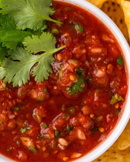 The best homemade salsa is made with juicy tomatoes, jalapeños, onion, fresh cilantro and plenty of spice and flavor! A little spicy, slightly sweet, and perfect with salty chips.  Great for game day/tailgating, parties, Mexican recipes and more!