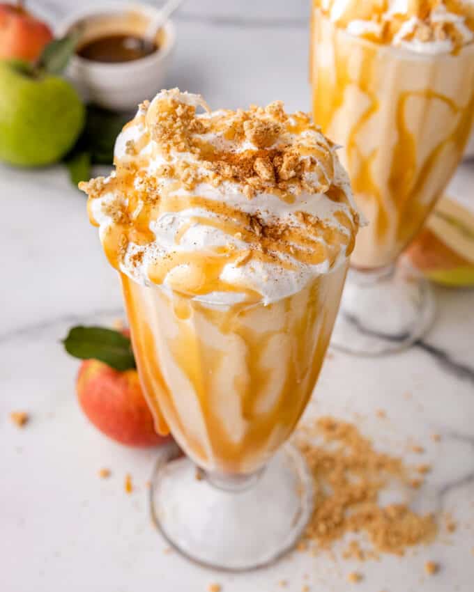 Everything you love about a sweet vanilla milkshake and rich slice of apple pie, combined in one amazing Fall dessert! These apple pie milkshakes are made with 5 simple ingredients (plus a couple of optional garnishes), and so simple to make!