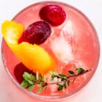 overhead view of the top of a glass filled with a whiskey cocktail