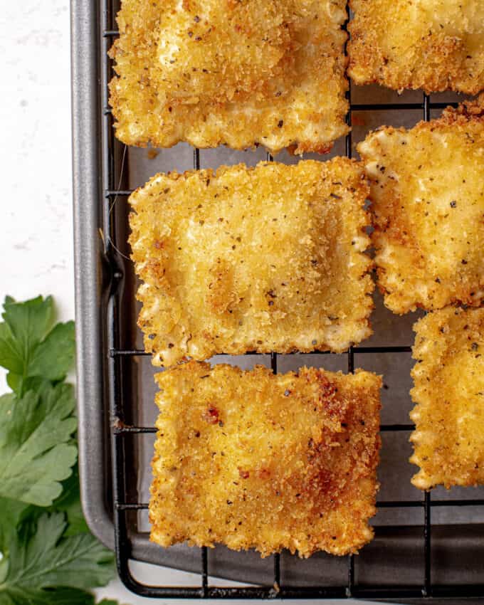 fried raviolis on a wire cooling rack