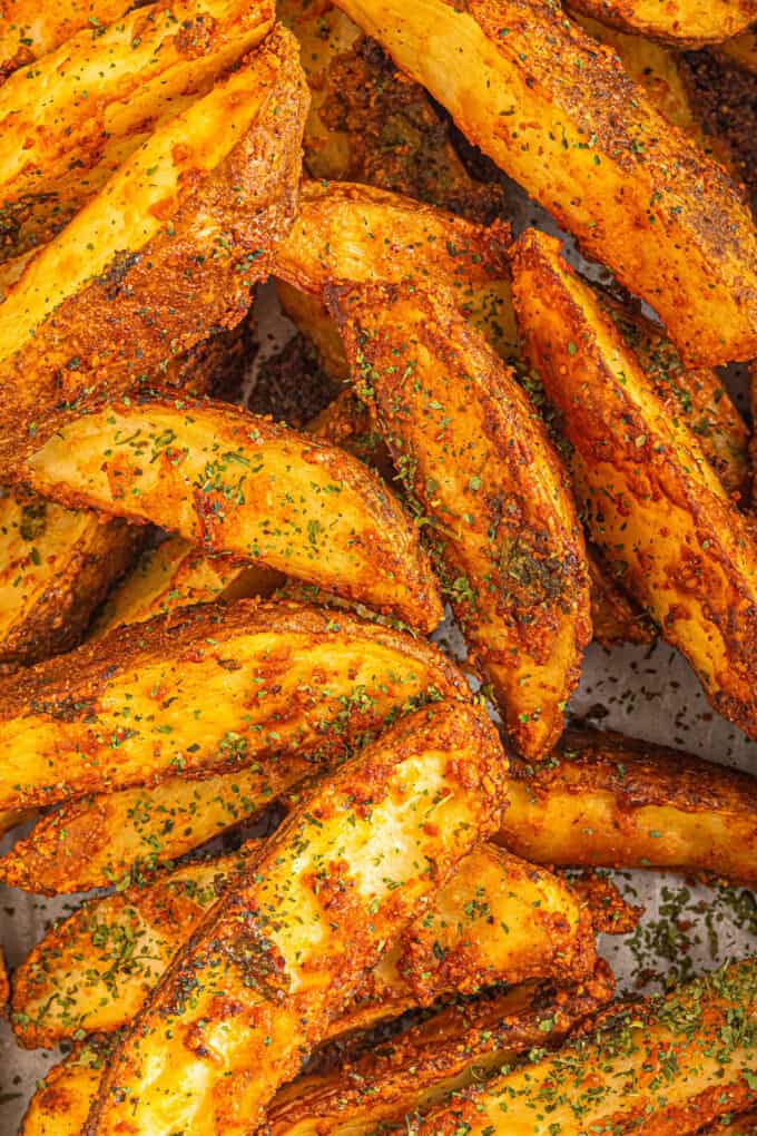 seasoned potato wedges on baking sheet